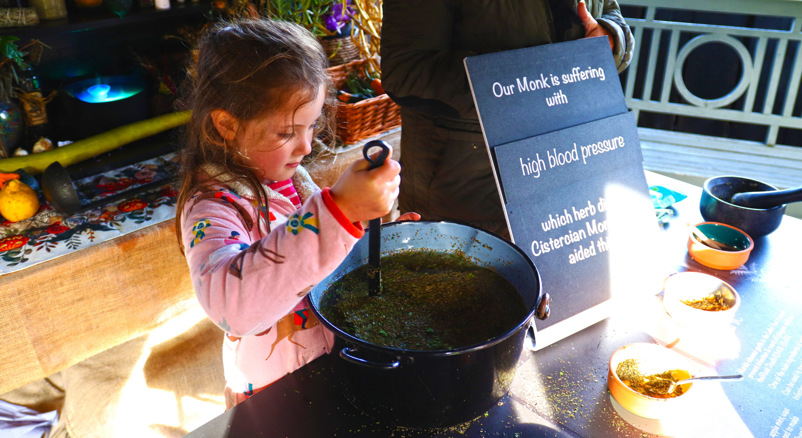 Family making potions at Beaulieu for October half-term